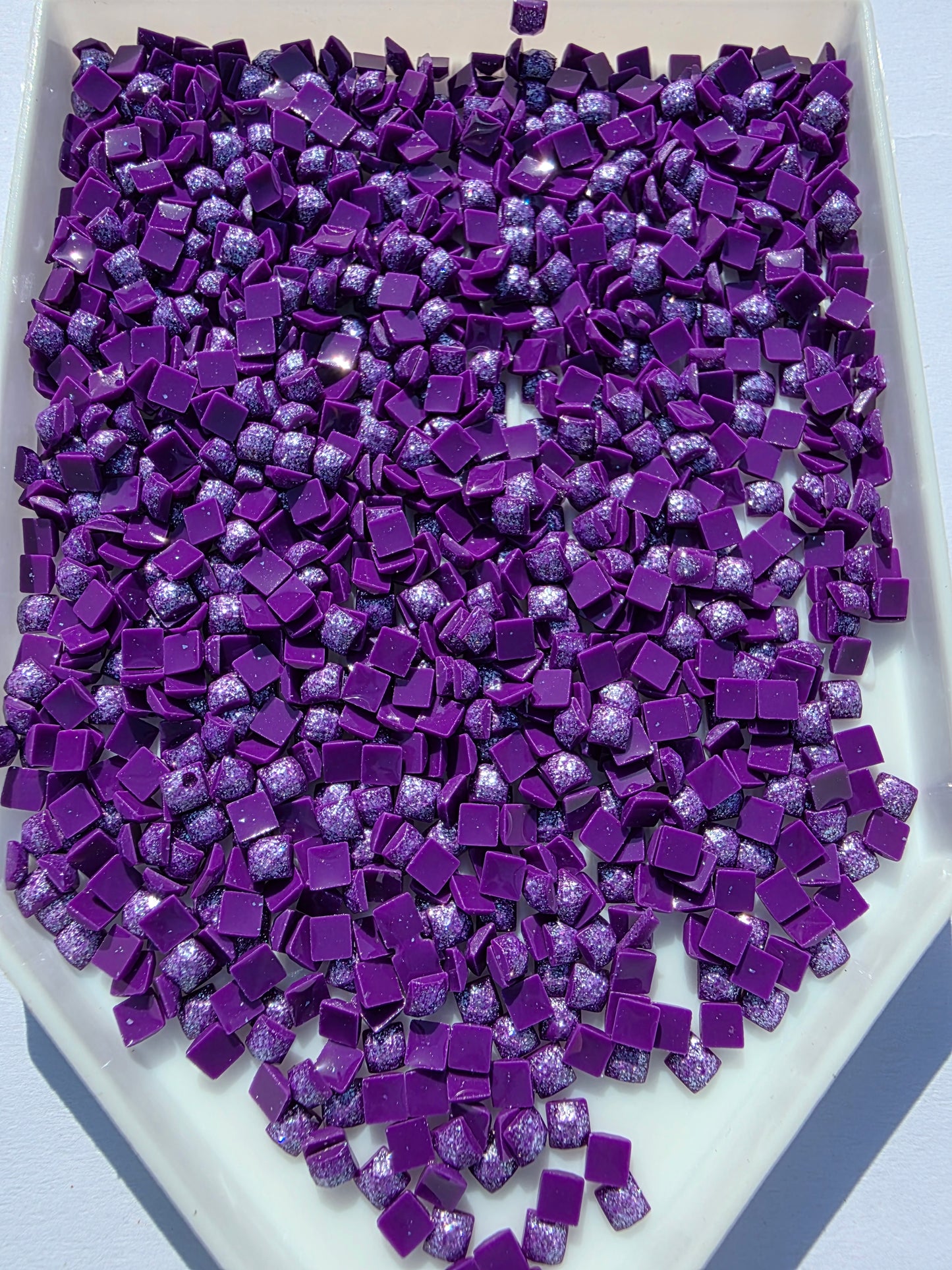 Square-shaped Fairy Dust Drills by Silaba Crafts, colorful and sparkling craft drills for jewelry and DIY projects.