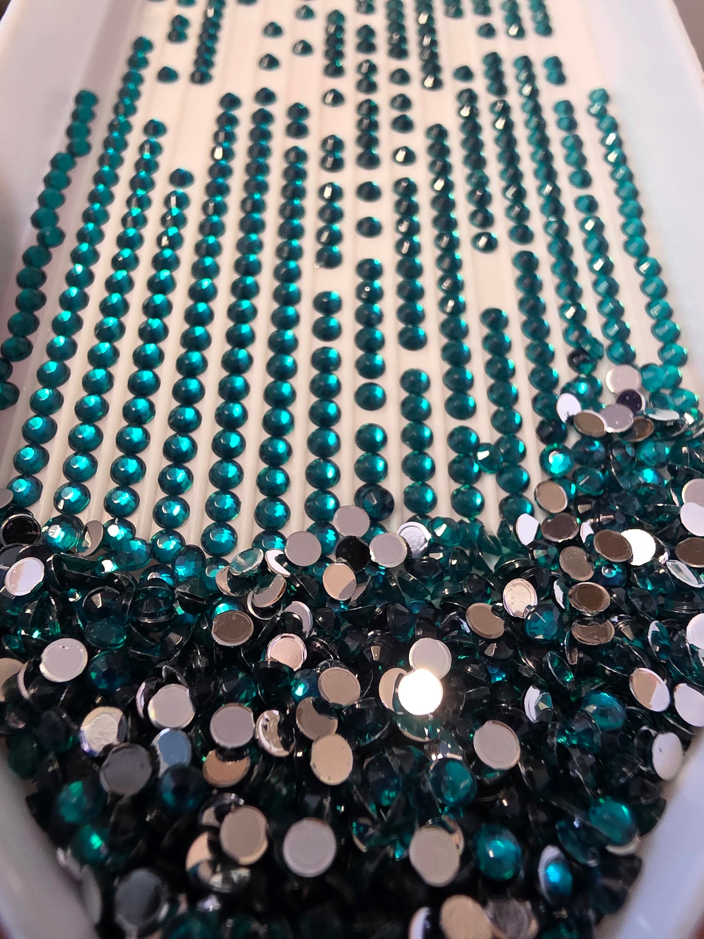Round diamond painting drills from Silaba Crafts, clear crystal beads arranged in a vibrant, sparkling pattern.