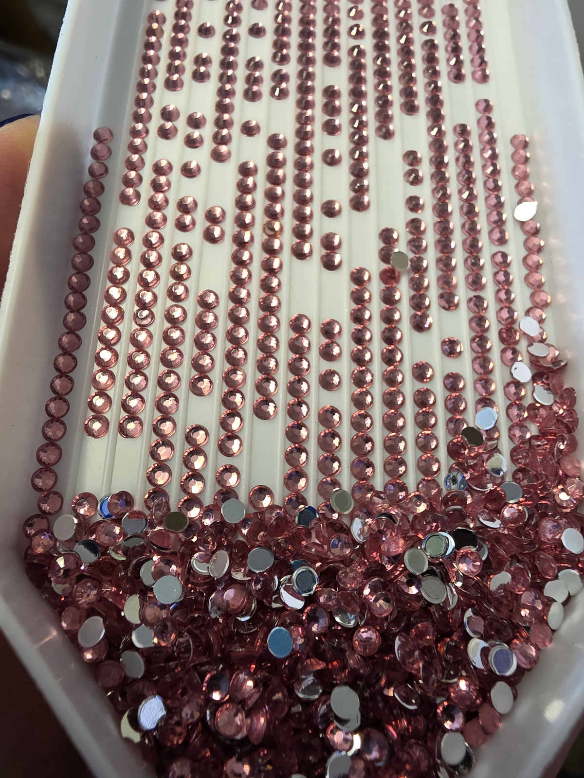Silaba Crafts round diamond painting drills beads in a clear container, ready for detailed crystal art projects.
